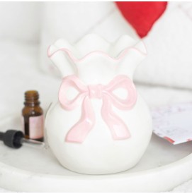 Weiße Duftlampe mit rosa...